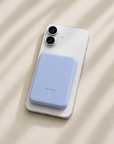 Ice blue magnetic power bank charging iPhone wirelessly