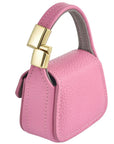 Pink leather mini purse charm magnetic closure and side stitching detail
