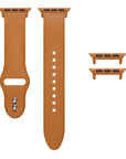 Rustic Caramel silicone Apple Watch® band unclasped, flat-lay view showing pin-and-tuck closure and size adapters