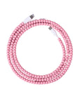 Pink USB-C beaded charging cable coiled on lavender background