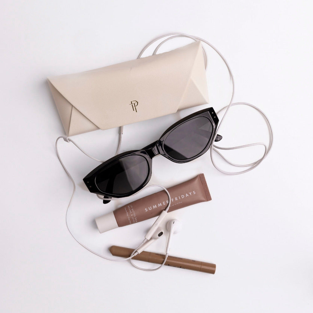 Josie Cateye Smart Sunglasses shown with protective case, cleaning cloth, and charging cable