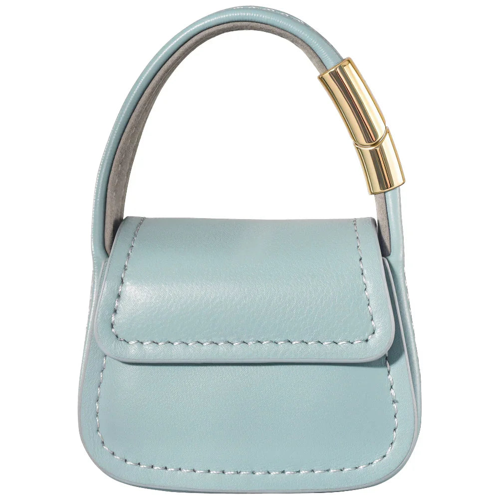 Blue leather mini purse charm closed with textured leather finish detail
