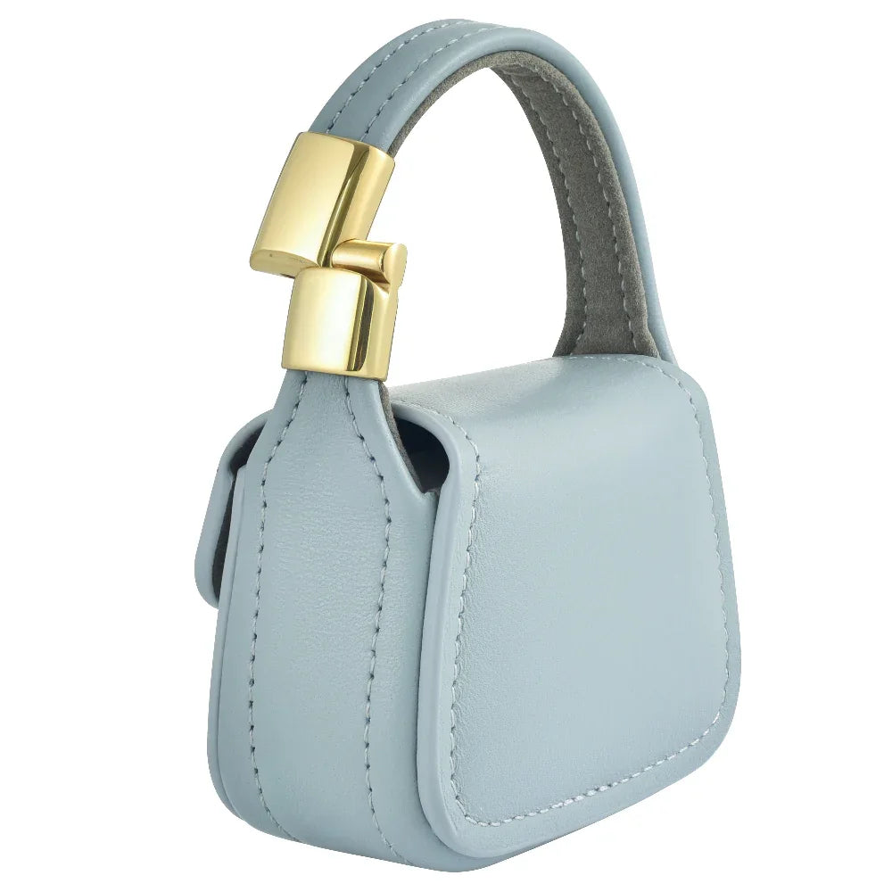 Blue leather mini purse charm magnetic closure and side stitching detail