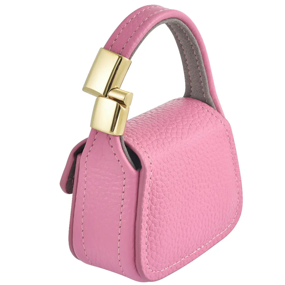 Pink leather mini purse charm magnetic closure and side stitching detail