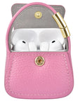 Pink leather mini purse charm open with AirPods Pro inside