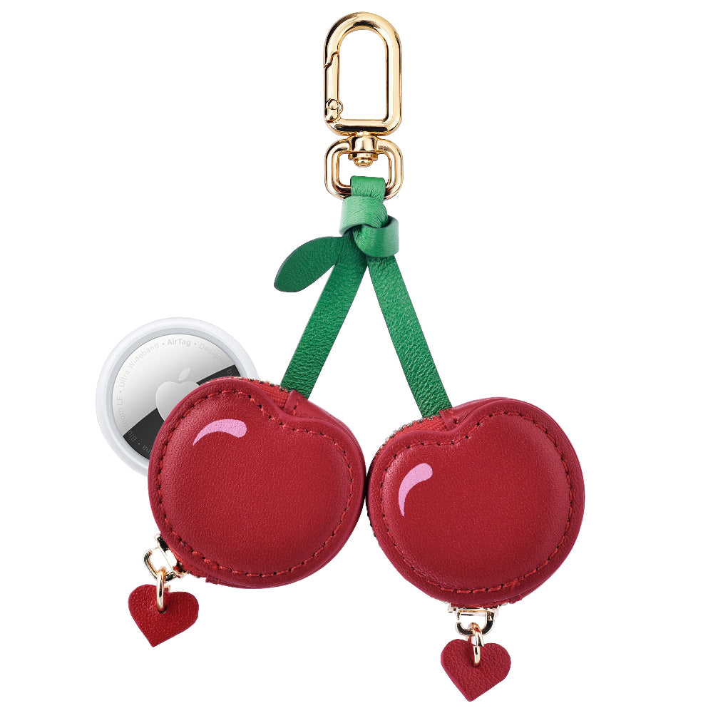 Cherry leather bag charm shown with AirTag inserted, Posh Tech glossy red leather design
