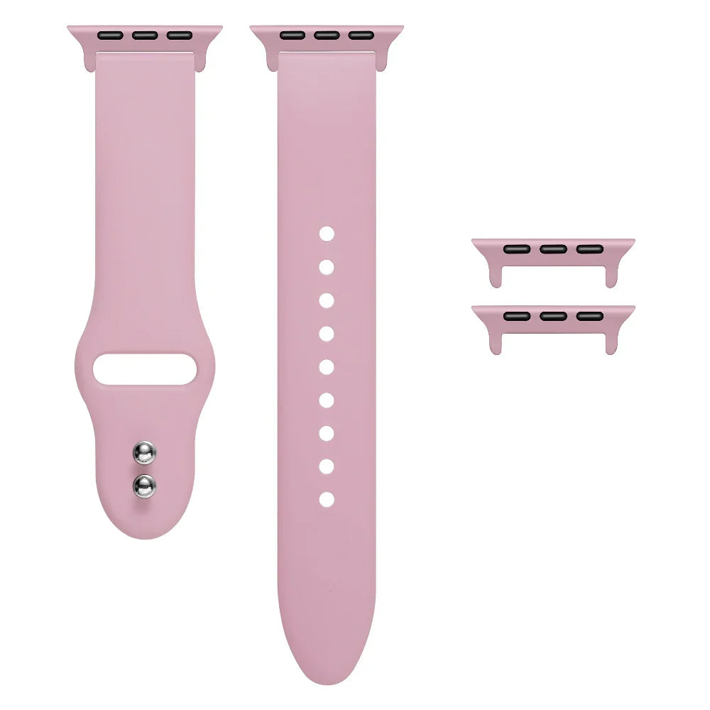 Cosmetic Pink silicone Apple Watch® band unclasped, flat-lay view showing pin-and-tuck closure and size adapters