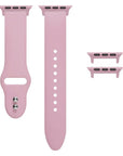 Cosmetic Pink silicone Apple Watch® band unclasped, flat-lay view showing pin-and-tuck closure and size adapters