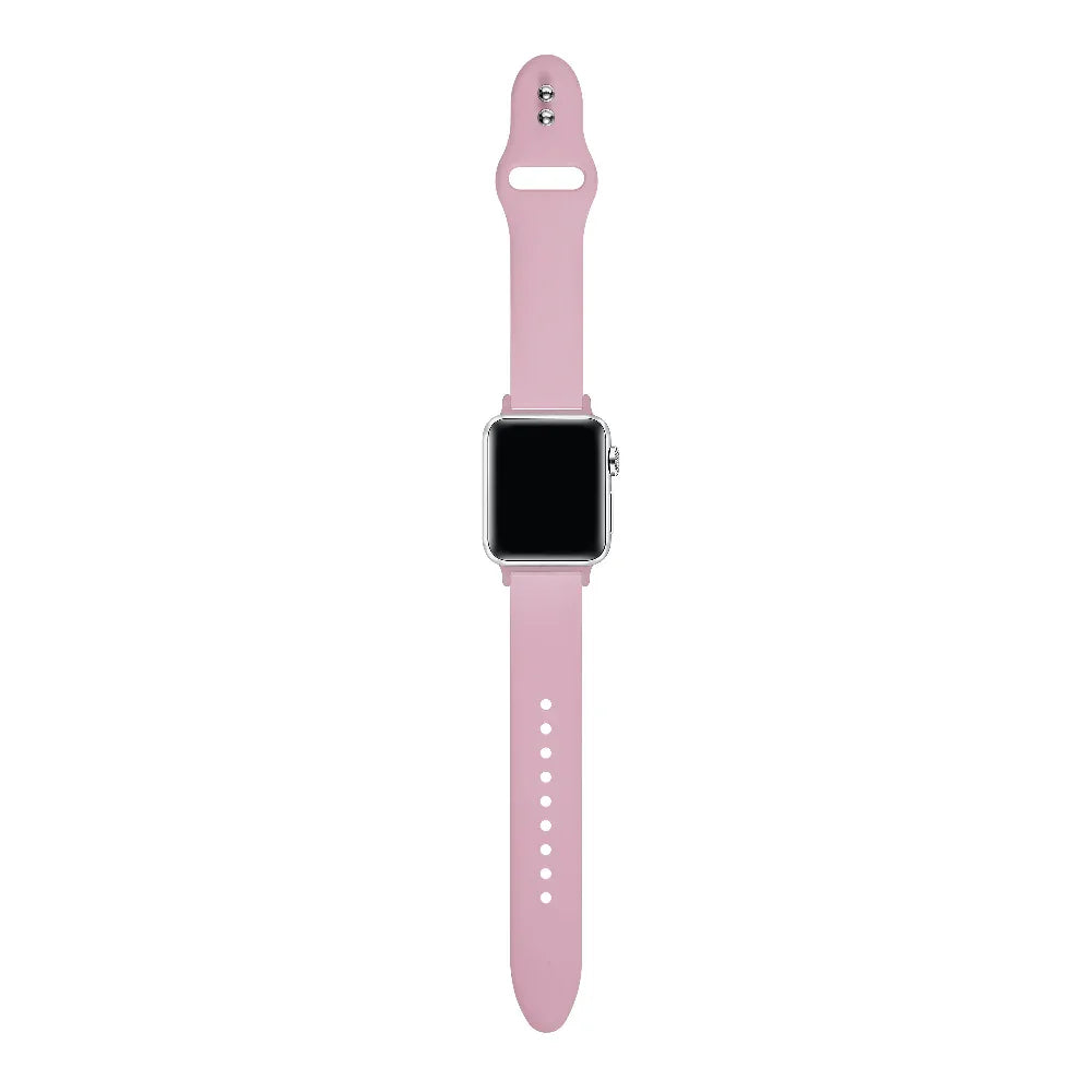 Cosmetic Pink silicone Apple Watch® band close-up, detail view of molded texture and pin closure holes