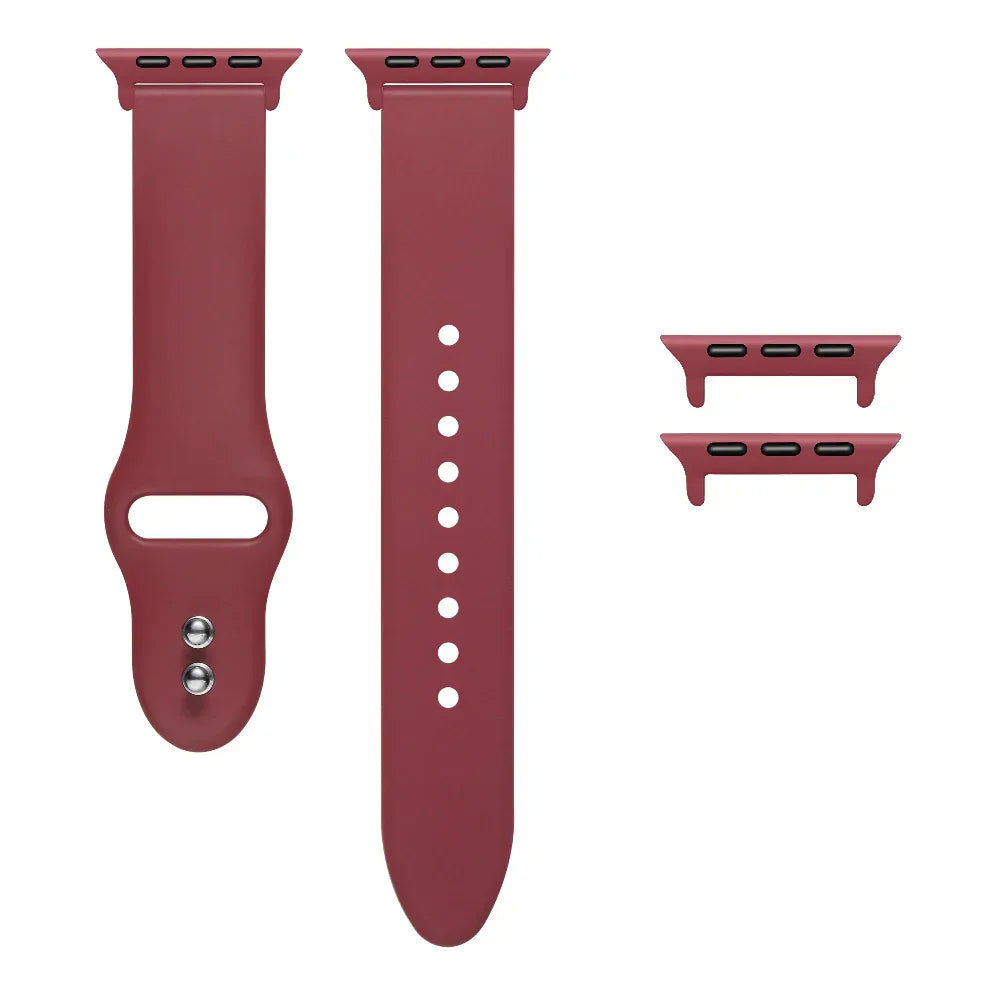 Cranberry Juice silicone Apple Watch® band unclasped, flat-lay view showing pin-and-tuck closure and size adapters