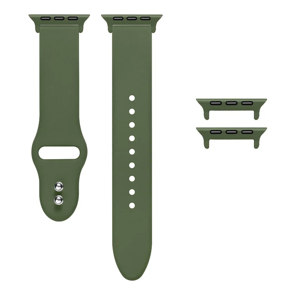 Olive green silicone Apple Watch® band unclasped, flat-lay view showing pin-and-tuck closure and size adapters
